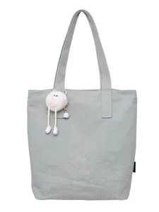 Grey canvas tote bag for women, large capacity casual shoulder bag with cute plush charm.