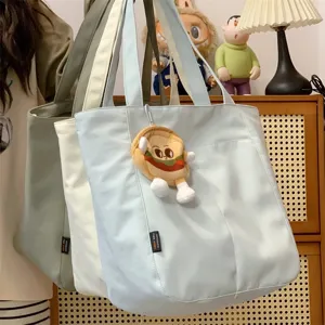 Casual canvas tote bag, large capacity minimalist shoulder bag for women student daily commute.