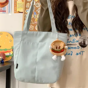 Casual canvas tote bag for women, large capacity shoulder bag with cute burger pendant.