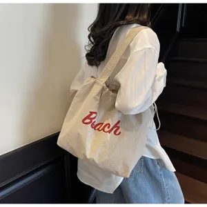 Bolso tote de lona para mujer, bolso de hombro informal de viaje con estampado de letras.