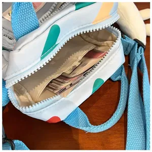 Detailed view of the cute canvas crossbody bag interior pocket, stylish summer daily use.