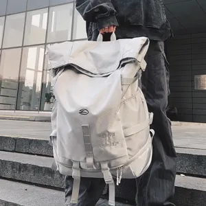 Detail view of large capacity grey outdoor travel backpack with stylish strap design and print.