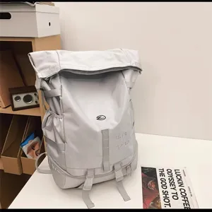 Light gray waterproof roll-top backpack detail, multi-pocket tactical daypack for outdoor travel.