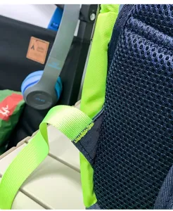 Close-up detail of backpack breathable mesh back panel and durable strap stitching.