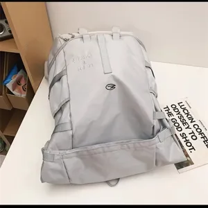 Large capacity casual sports backpack for outdoor travel multi-functional grey bag.