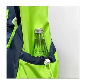 Close-up detail of backpack side pocket with drawstring and bottle storage design, functional.