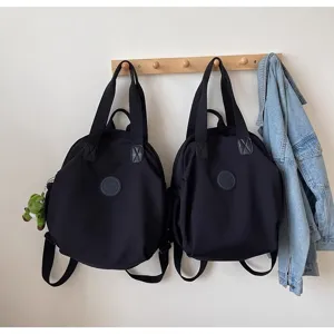 Grand sac à dos noir léger de grande capacité design rond élégant sac d'école décontracté