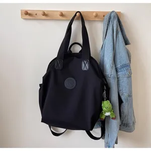 Sac à dos en nylon noir avec poignée sac de voyage décontracté avec détail de pendentif dinosaure mignon