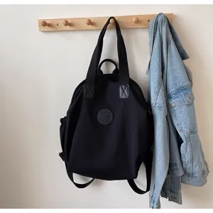 Sac à dos décontracté léger de grande capacité noir, vue détaillée du design et du tissu.
