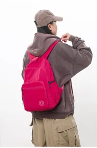 Close-up detail showing the back wear effect of the lightweight pink casual backpack.