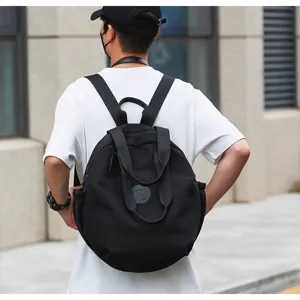 Grand sac à dos rond noir pour femme, design de niche élégant sac d'école de voyage pour étudiant.