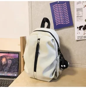 Casual lightweight white backpack for daily travel, school, and outdoor activities with front zipper.