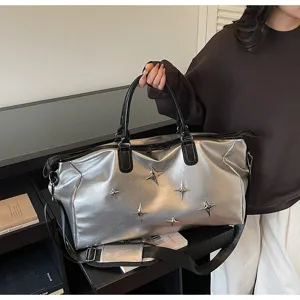 Large capacity silver travel duffel bag with stylish star studs, lightweight portable gym bag.