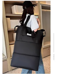 Grande borsa da viaggio espandibile da donna, borsone nero impermeabile per weekend.