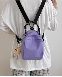 Lightweight purple canvas backpack for women, multi-functional casual shoulder and travel bag.