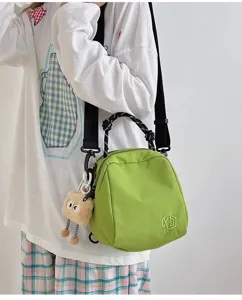 Lightweight canvas crossbody bag for women, casual shell shoulder bag with cute plush pendant.