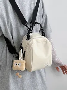 Casual canvas mini backpack for women, convertible shoulder bag and stylish crossbody purse.