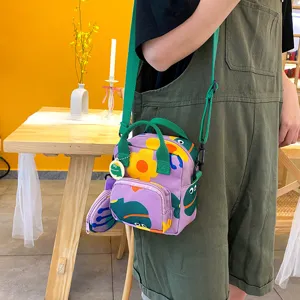 Japanese style purple canvas crossbody bag with green handles and cute floral print coin purse.