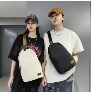 Sac à bandoulière en toile décontracté pour hommes et femmes, style rétro grande capacité.