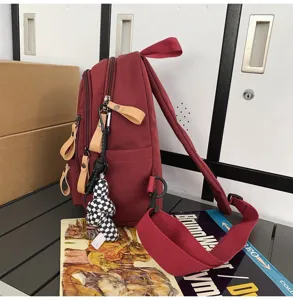Canvas casual travel backpack detail view, featuring durable fabric, side pockets and straps.
