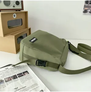 Detailed view of Japanese solid canvas messenger bag, casual crossbody for daily wear.