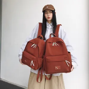 Casual minimalist canvas backpack for women, lightweight school bag and travel daypack daily use.