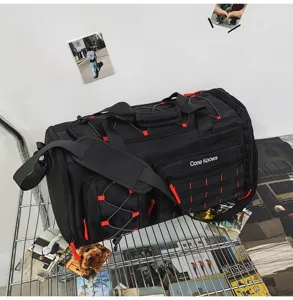 Large capacity black travel duffel bag with red accents and multiple utility pockets for gym.