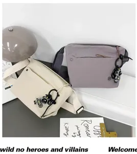 Casual nylon crossbody bag for women, lightweight waterproof shoulder bag with cute astronaut charm.