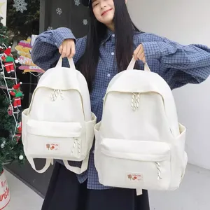 Casual white school backpack for women, lightweight travel daypack and commute bag