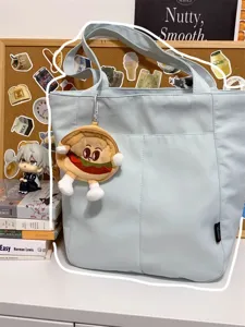 Casual Japanese style canvas tote bag for women, large capacity shoulder bag for daily commute.