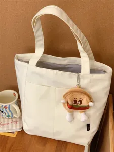 Minimalist aesthetic canvas tote bag for women, large capacity daily shoulder bag for commute.