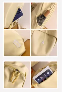 Lässiger gelber Schulrucksack mit vielen Fächern und stilvollen Bestickungsdetails für Studenten.
