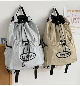 Sac à dos léger avec cordon de serrage, grande capacité pour le voyage et l'école.