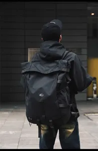 Large capacity black tactical backpack, multi-functional outdoor travel sports bag detail.
