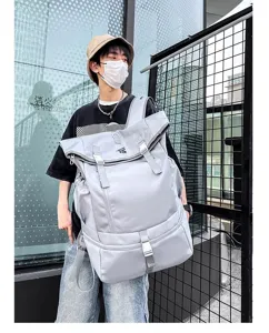 Large capacity grey roll-top backpack for men, outdoor travel and sports training bag.