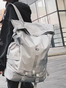 Large capacity trendy roll-top backpack for men, ideal for outdoor travel and sports use.