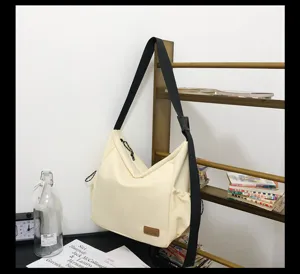 Large capacity canvas messenger bag for women and men, casual versatile single shoulder travel bag.