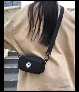 Waterproof mini crossbody bag for women and men, stylish small phone shoulder bag.