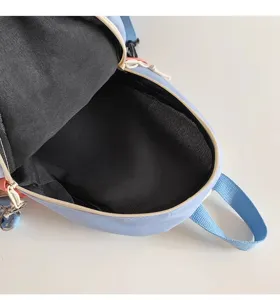 Light blue casual chest bag detail view, multi-functional sling backpack for daily use.