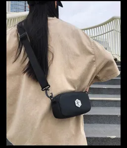 Waterproof minimalist cross-body bag for men and women, casual black daily mini shoulder bag.