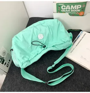 Lightweight outdoor travel crossbody bag in mint green, large capacity fitness gym bag.