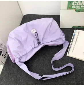 Lavender lightweight travel crossbody bag detail, showing large capacity and durable strap.