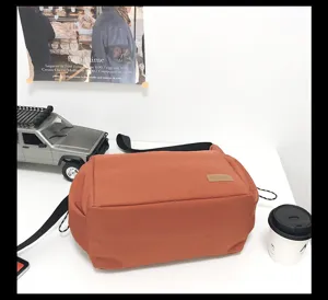Large capacity canvas messenger bag casual retro shoulder bag for daily travel and outdoor use.