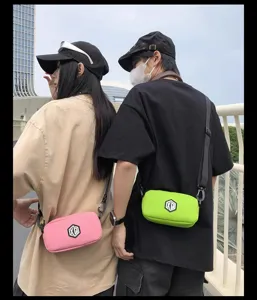 Detailed view of fashionable waterproof crossbody phone bag for men and women, portable design.