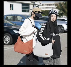 Large capacity canvas crossbody bag for men and women, casual vintage messenger shoulder bag.