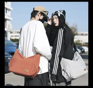 Casual canvas crossbody bag detail view, large capacity shoulder messenger bag for daily travel.