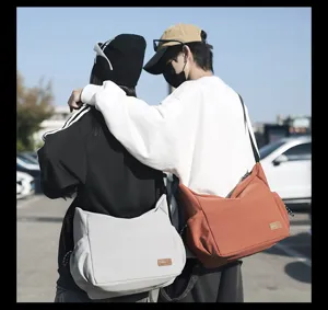 Large capacity canvas crossbody bag for men and women, casual daily travel shoulder bag.