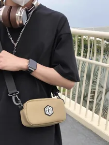 Casual waterproof crossbody bag for men and women, portable shoulder bag for daily use.