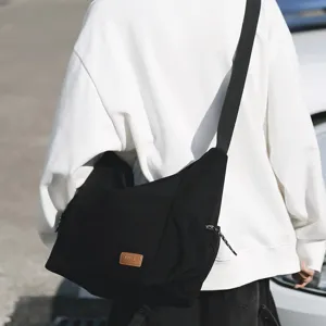 Large capacity canvas crossbody bag for women and men, casual lightweight travel messenger bag.