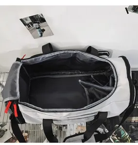 Large capacity travel duffel bag detail showing spacious interior compartment and durable zippers.